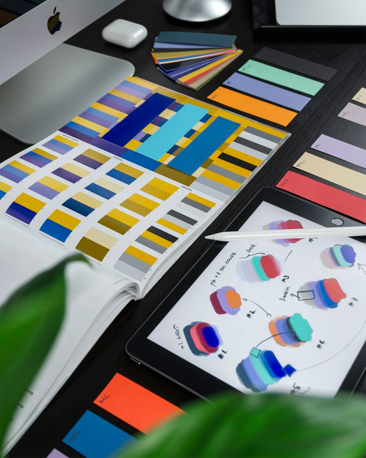 Brand colour swatches and logo sketches